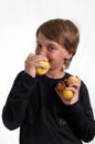 Portrait of Boy eating an apple .