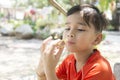 Portrait of a boy eating bread ice cream roll sandwich Royalty Free Stock Photo