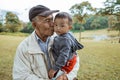 boy embracing grandfather in the backyard. grandson and grandparent outdoor Royalty Free Stock Photo