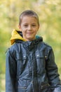 Portrait of boy in the forest smiling to the camera. Royalty Free Stock Photo