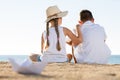 boy and girl sitting beach Royalty Free Stock Photo