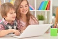 Portrait of Boy and girl using laptop Royalty Free Stock Photo