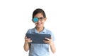 Portrait of boy in glasses with patch for glasses. Boy with tablet. Treat lazy eye, amblyopia, strabismus.  Remote learning. Dista Royalty Free Stock Photo