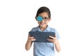 Portrait of boy in glasses with patch for glasses. Boy with tablet. Treat lazy eye, amblyopia, strabismus.  Remote learning. Dista Royalty Free Stock Photo