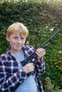 Portrait of Boy Holding an Air Pistol Royalty Free Stock Photo
