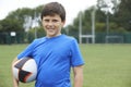 Portrait Of Boy Holding Ball On School Rugby Pitch Royalty Free Stock Photo