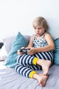 Boy holding joystick gaming controller in hands, playing video game at home. Royalty Free Stock Photo