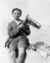 Portrait of a boy holding a model airplane and smiling Royalty Free Stock Photo