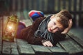 Portrait of a boy with a kerosene lamp Royalty Free Stock Photo