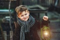 Portrait of a boy with a kerosene lamp Royalty Free Stock Photo