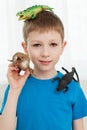 Portrait of a boy playing with dinosaur