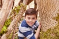 Portrait Of Boy Playing Game In Forest Royalty Free Stock Photo