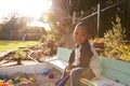 Portrait Of Boy Playing In Sand Box Outdoors In Garden Royalty Free Stock Photo