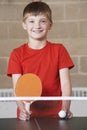 Portrait Of Boy Playing Table Tennis In School Gym Royalty Free Stock Photo