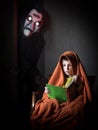 Portrait of a boy reading a book of spooky stories Royalty Free Stock Photo