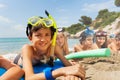 Boys and girls in scuba masks on the beach Royalty Free Stock Photo