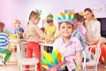 Portrait of boy show paper craft headwear Royalty Free Stock Photo