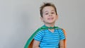 Portrait of a boy smiling. little boy playing a superhero. Kid in an Superhero`s costume. happy child. green mask Royalty Free Stock Photo