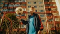 Portrait of a Boy in Sport Clothes Throwing and Catching a Soccer Ball, Standing Next to a Football Royalty Free Stock Photo