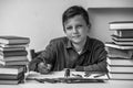 Portrait of boy student doing homework. Black and white photo. Royalty Free Stock Photo