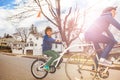 Portrait of a boy in tandem bike towed by father