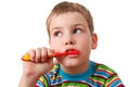 Portrait of boy with toothbrush on white