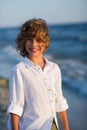 Portrait of boy of 10-11 years against the background of the rough sea. Royalty Free Stock Photo