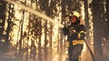 Portrait of a Brave Professional Firefighter Using a Firehose to Fight a Raging Dangerous Forest