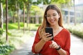 Portrait of Brazilian woman using mobile phone in Sao Paulo sustainable metropolis