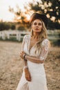 Portrait of the bride. A beautiful woman in white wedding dress in bohemian style. Sunset Royalty Free Stock Photo