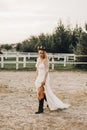 Portrait of the bride. A beautiful woman in white wedding dress in bohemian style. Sunset Royalty Free Stock Photo