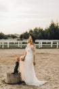 Portrait of the bride. A beautiful woman in white wedding dress in bohemian style. Sunset Royalty Free Stock Photo