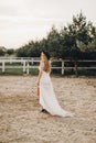 Portrait of the bride. A beautiful woman in white wedding dress in bohemian style. Sunset Royalty Free Stock Photo