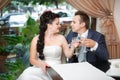 Portrait of bride and groom drinking champagne at luxury restaurant Royalty Free Stock Photo