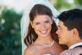 Portrait, bride and groom embrace at wedding with smile, love and commitment at reception. Garden, face of woman and man