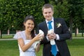 Portrait of bride and groom in the hands of the pigeons Royalty Free Stock Photo