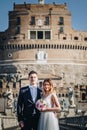 Portrait of bride and groom posing on the streets of Rome, Italy Royalty Free Stock Photo