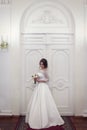 Portrait of the bride next to the beautiful door Royalty Free Stock Photo