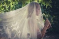 Portrait of bride with veil and bouquet of wild flowers outdoor Royalty Free Stock Photo