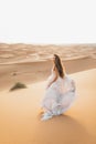 Portrait of bride woman in amazing wedding dress in Sahara desert, Morocco Royalty Free Stock Photo