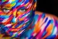 Portrait of the bright beautiful girl with art colorful make-up and bodyart