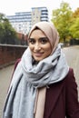 Portrait Of British Muslim Woman In Urban Environment