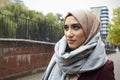 Portrait Of British Muslim Woman In Urban Environment