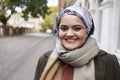 Portrait Of British Muslim Woman In Urban Environment