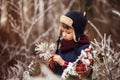 Portrait brooding cute boy in warm winter forest Royalty Free Stock Photo