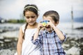 Portrait of a brother and sister children with toy camera Royalty Free Stock Photo