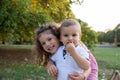 Portrait of brother and sister embracing in a park in the open air, concept of family love Royalty Free Stock Photo