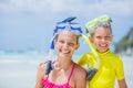 Portrait of Brother and sister in scuba masks playing on the beach during the hot summer vacation day. Royalty Free Stock Photo