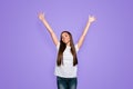 Portrait of brown-haired gorgeous attractive nice excited smiling young lady with long straight hair wearing jeans and Royalty Free Stock Photo