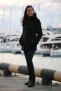 Portrait of a brunette girl looking into the distance in winter in the port in Sochi Russia Royalty Free Stock Photo